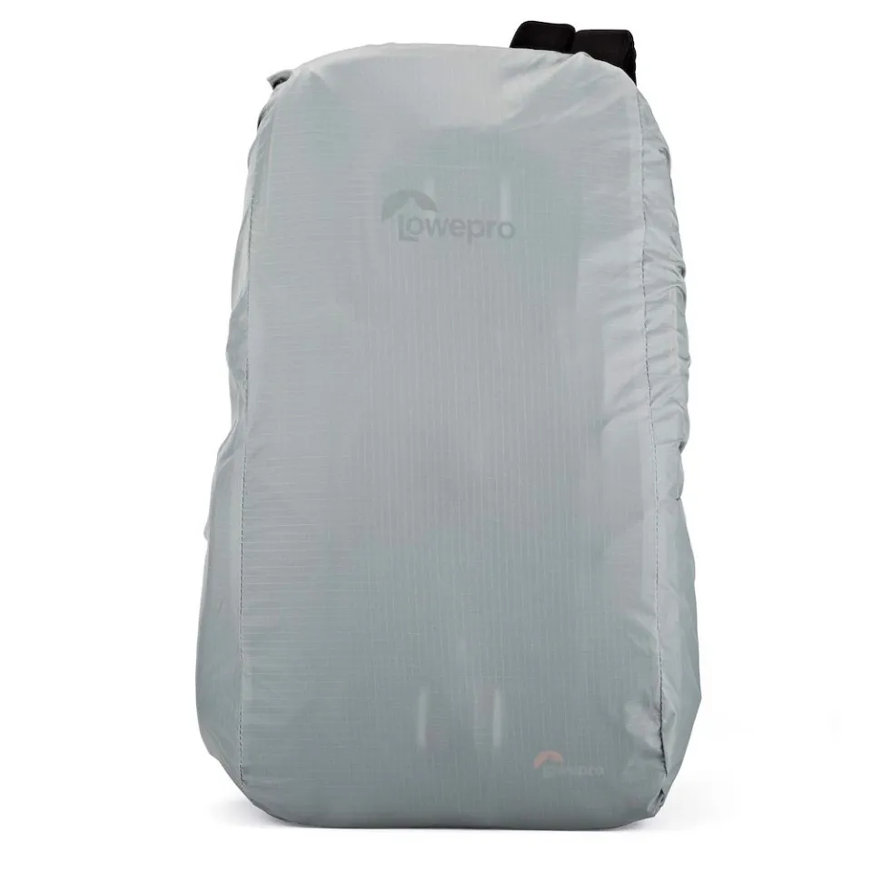 The grey Lowepro All Weather AW rain cover pulled over the camera sling bag, with the Lowepro logo visible