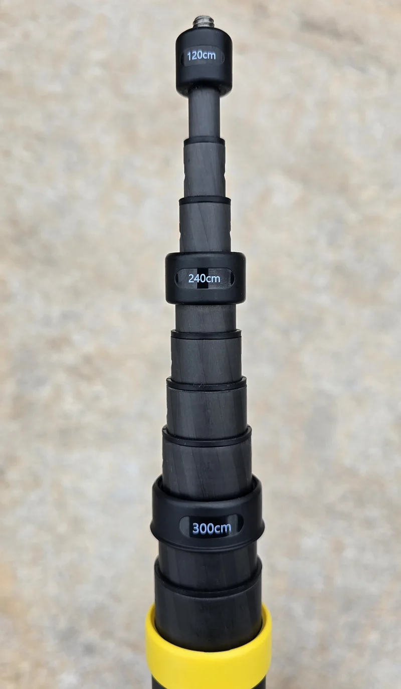 The Insta360 stick partly extended, sections marked 120cm, 240cm and 300cm