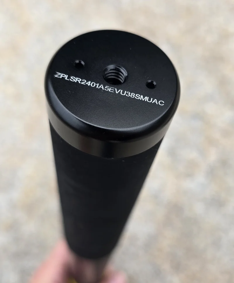 The bottom of the stick showing a 1/4-inch female screw mount flanked by two locating posts