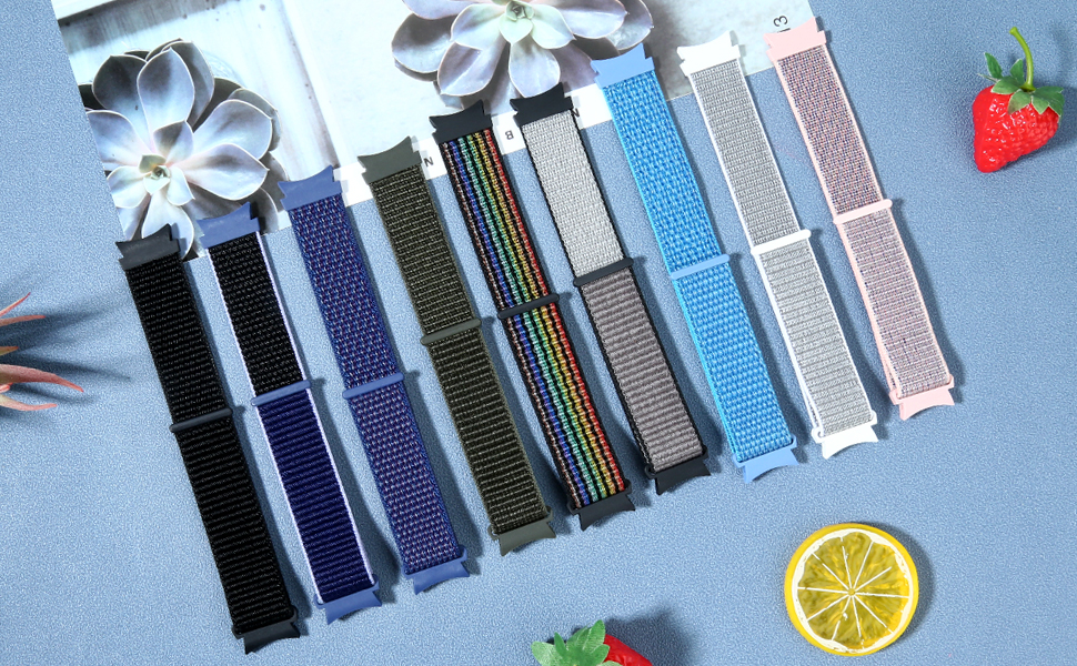 Flat-lay of the PBFairyy nylon watch bands in many colors, from black and navy to rainbow, grey, blue and pink